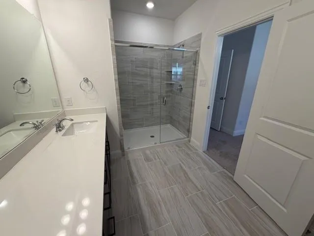 a bathroom with a sink and shower