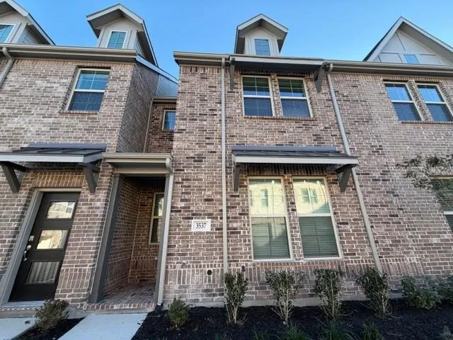 a front view of a house with glass windows
