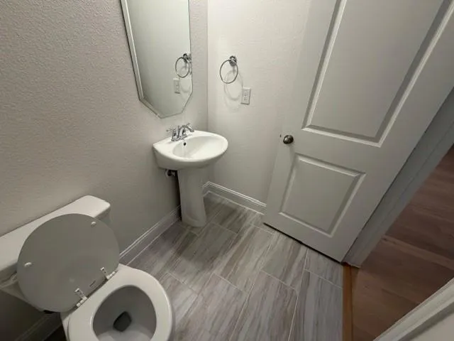 a bathroom with a sink and mirror