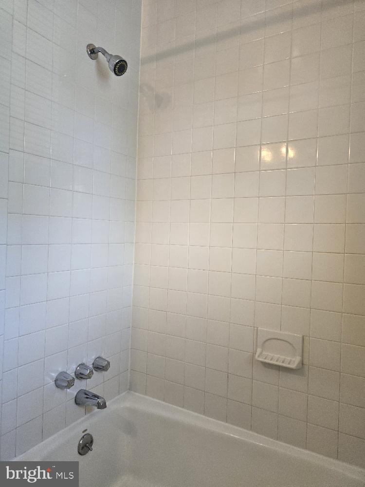 7612 Clive Place Springfield, VA 22151 - Photo 16 of 23 a bathroom with a shower
