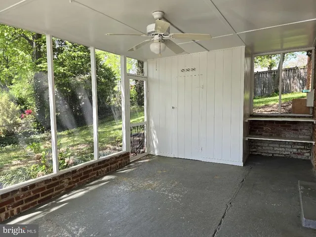 a view of a room with a large window