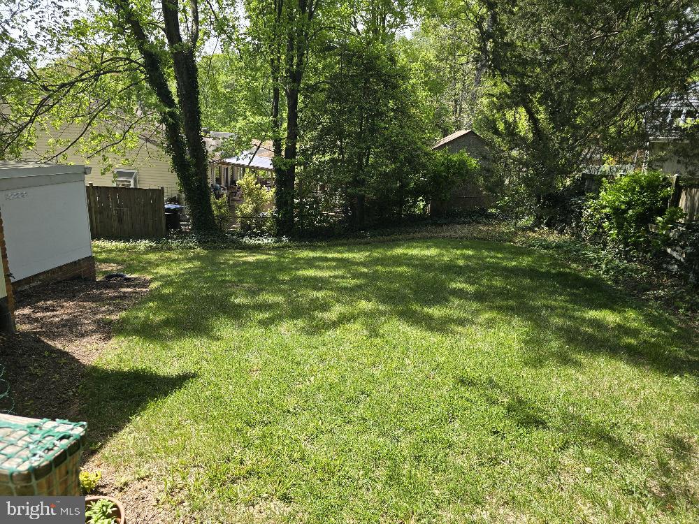 7612 Clive Place Springfield, VA 22151 - Photo 20 of 23 a backyard of a house with lots of green space