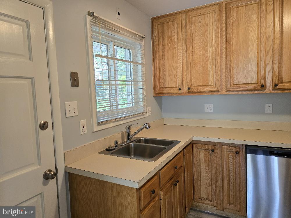 7612 Clive Place Springfield, VA 22151 - Photo 7 of 23 a kitchen with a sink cabinets and window
