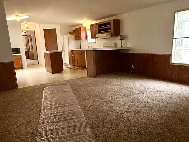 a view of kitchen with furniture and window