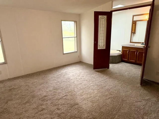 an empty room with windows