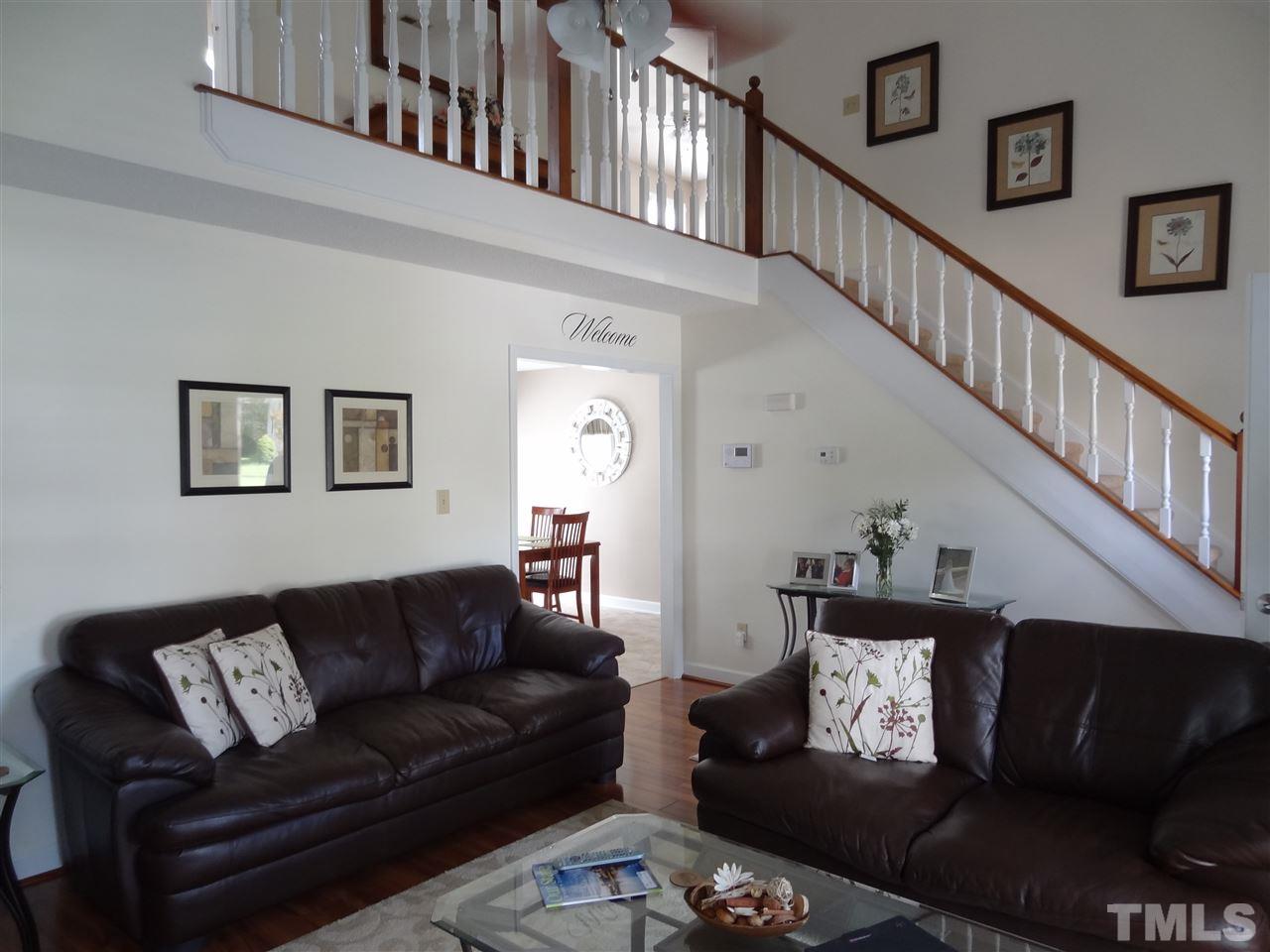 4416 Bartholomew Circle Raleigh, NC 27604 - Photo 3 of 24 a living room with furniture and a wooden floor