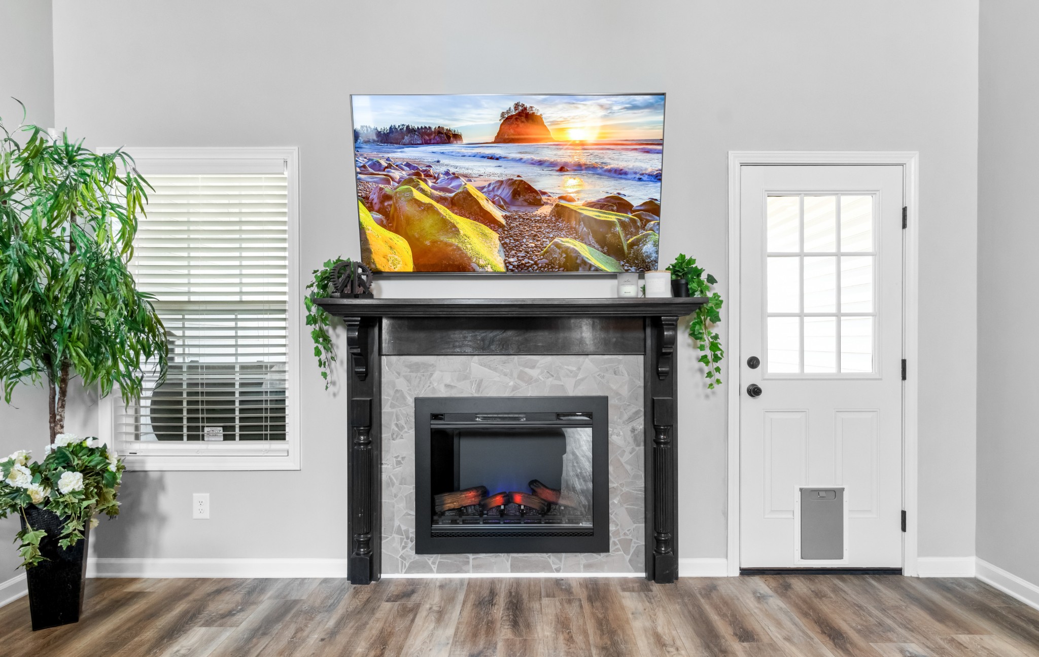 218 Elwell Road Clarksville, TN 37042 - Photo 8 of 35 Electric Fireplace with Wooden Mantle and Tile Surrounding! Living Room also has Access to the Covered Deck!