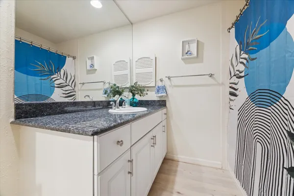 a kitchen with stainless steel appliances granite countertop a sink and a granite counter tops