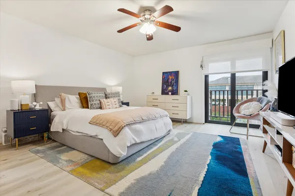 a spacious bedroom with a bed and a walk in closet