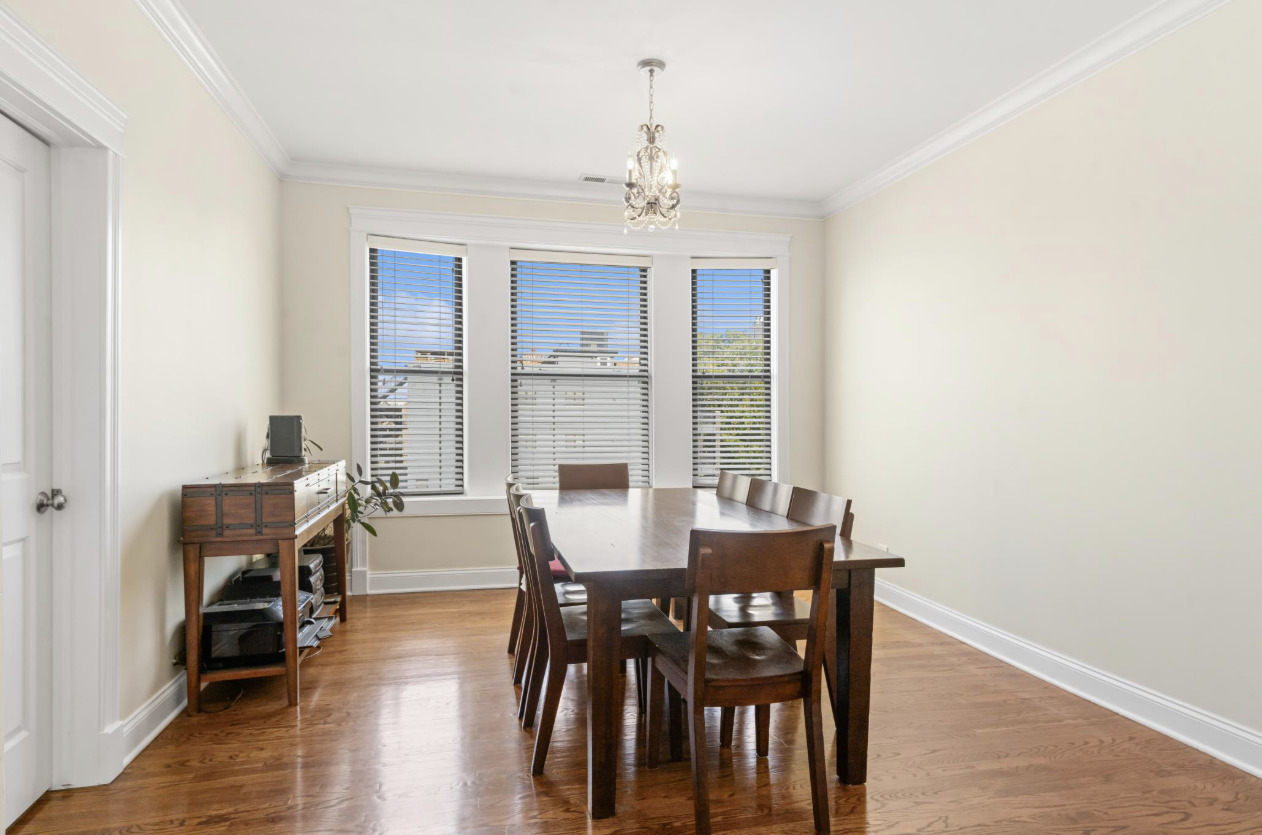 4834 North Kenmore Avenue, Unit 3N Chicago, IL 60640 - Photo 11 of 28 a view of a dining room with furniture and wooden floor