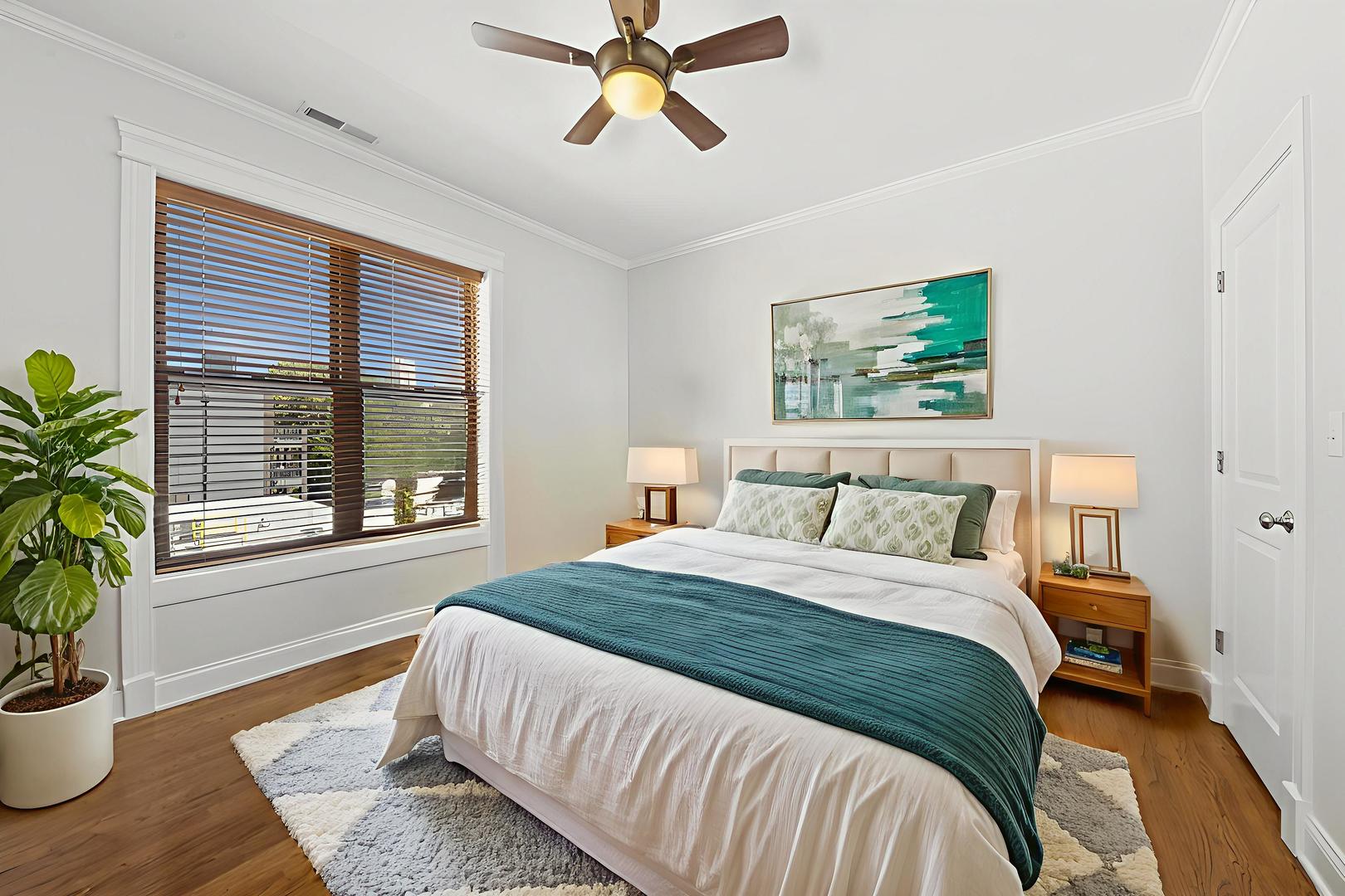 4834 North Kenmore Avenue, Unit 3N Chicago, IL 60640 - Photo 12 of 28 a bedroom with a bed and wooden floor