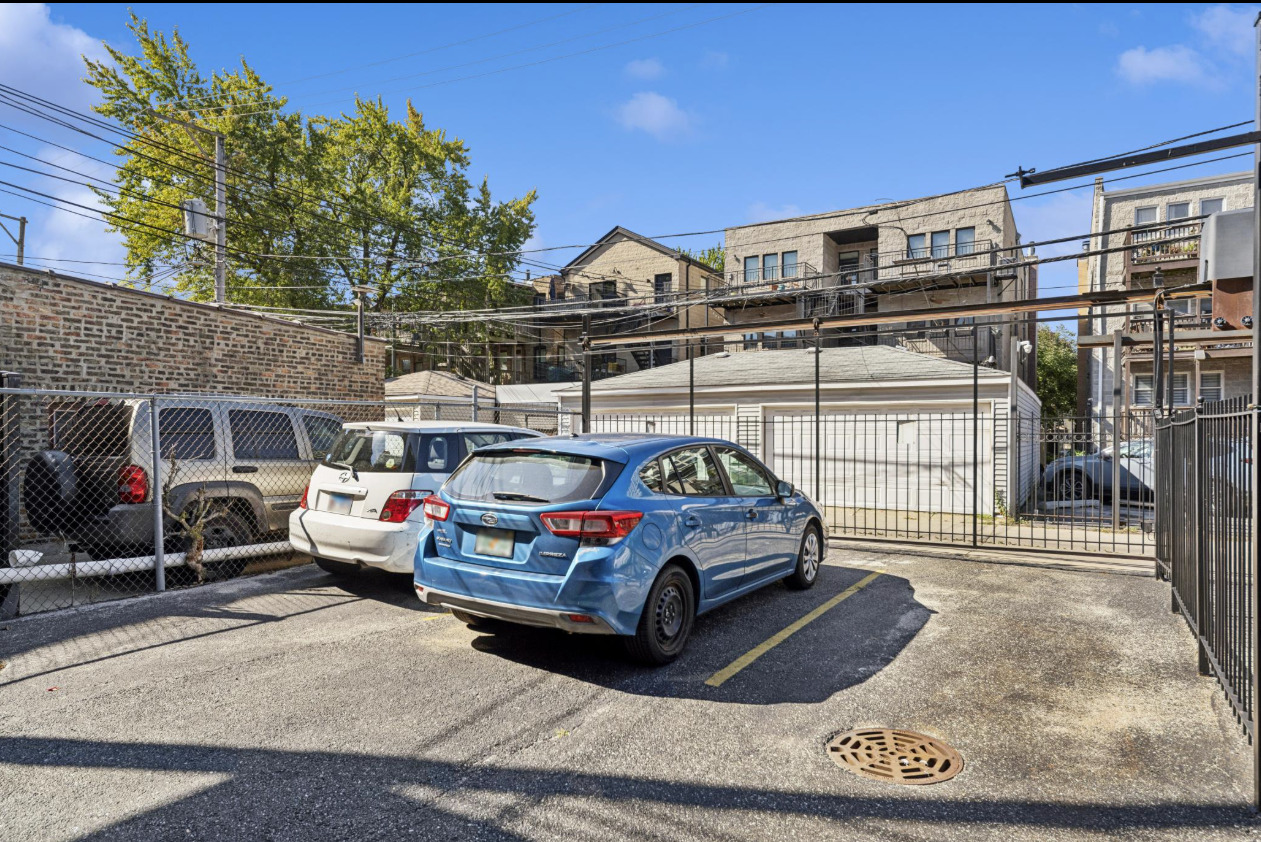 4834 North Kenmore Avenue, Unit 3N Chicago, IL 60640 - Photo 22 of 28 a car parked in front of a building