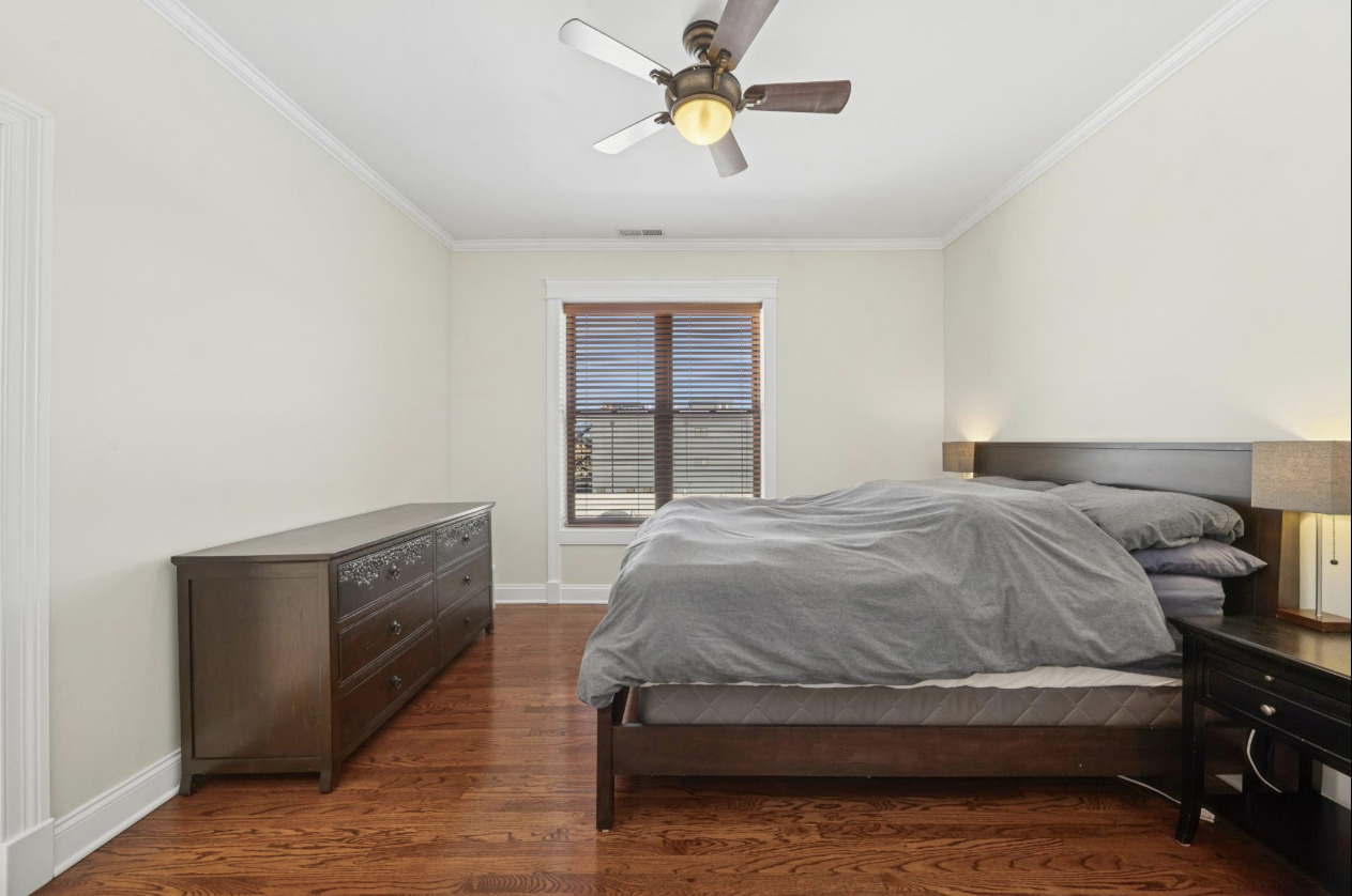 4834 North Kenmore Avenue, Unit 3N Chicago, IL 60640 - Photo 24 of 28 a bedroom with a bed and window