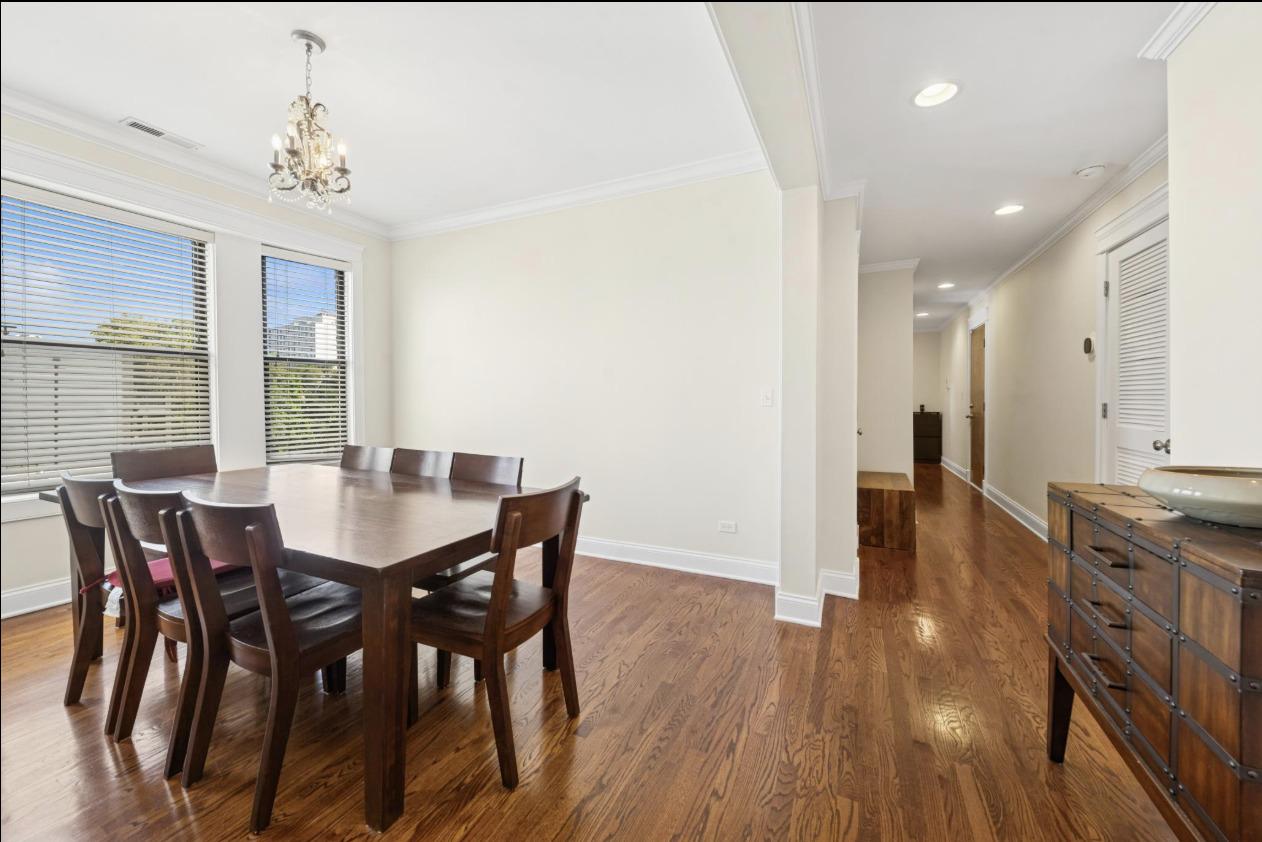 4834 North Kenmore Avenue, Unit 3N Chicago, IL 60640 - Photo 26 of 28 a view of a dining room with furniture and wooden floor