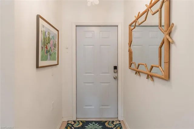 a view of a hallway with paintings on the wall