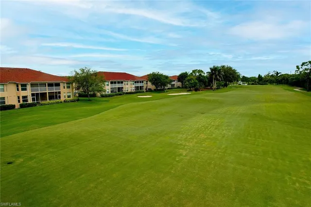a city view with tall buildings and a yard