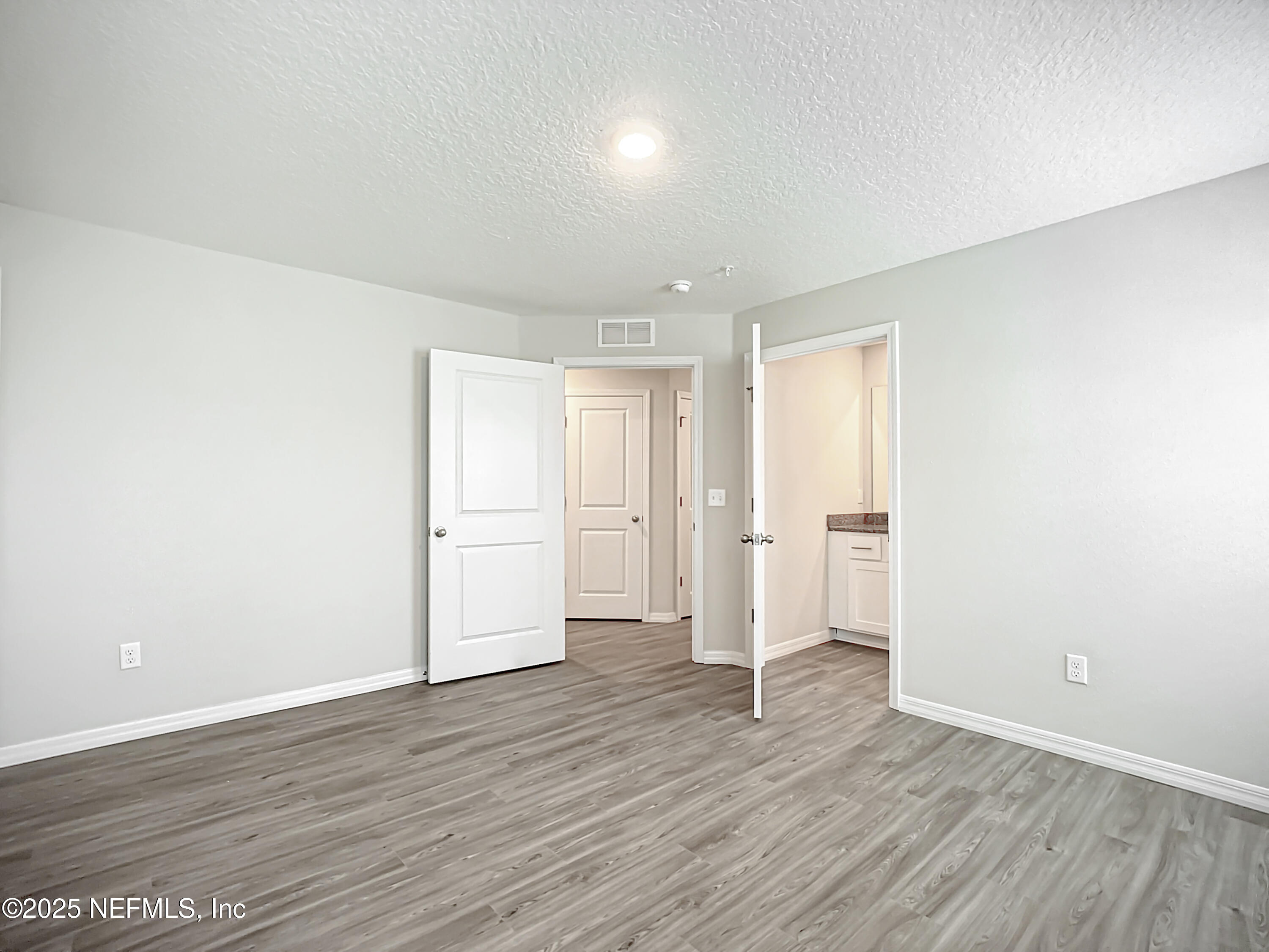 9612 Hood Road Jacksonville, FL 32257 - Photo 15 of 20 a view of empty room with wooden floor