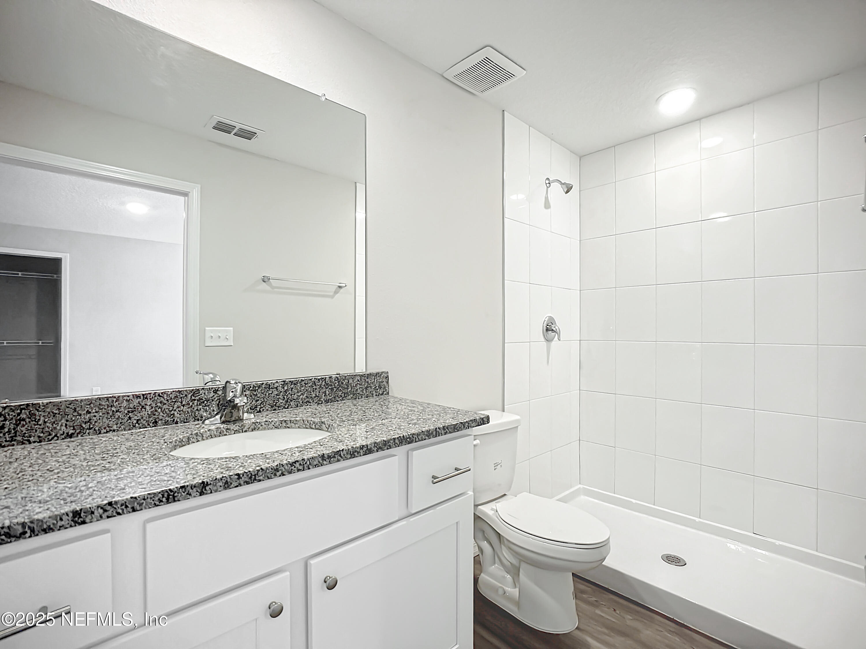 9612 Hood Road Jacksonville, FL 32257 - Photo 17 of 20 a bathroom with a granite countertop sink toilet and shower