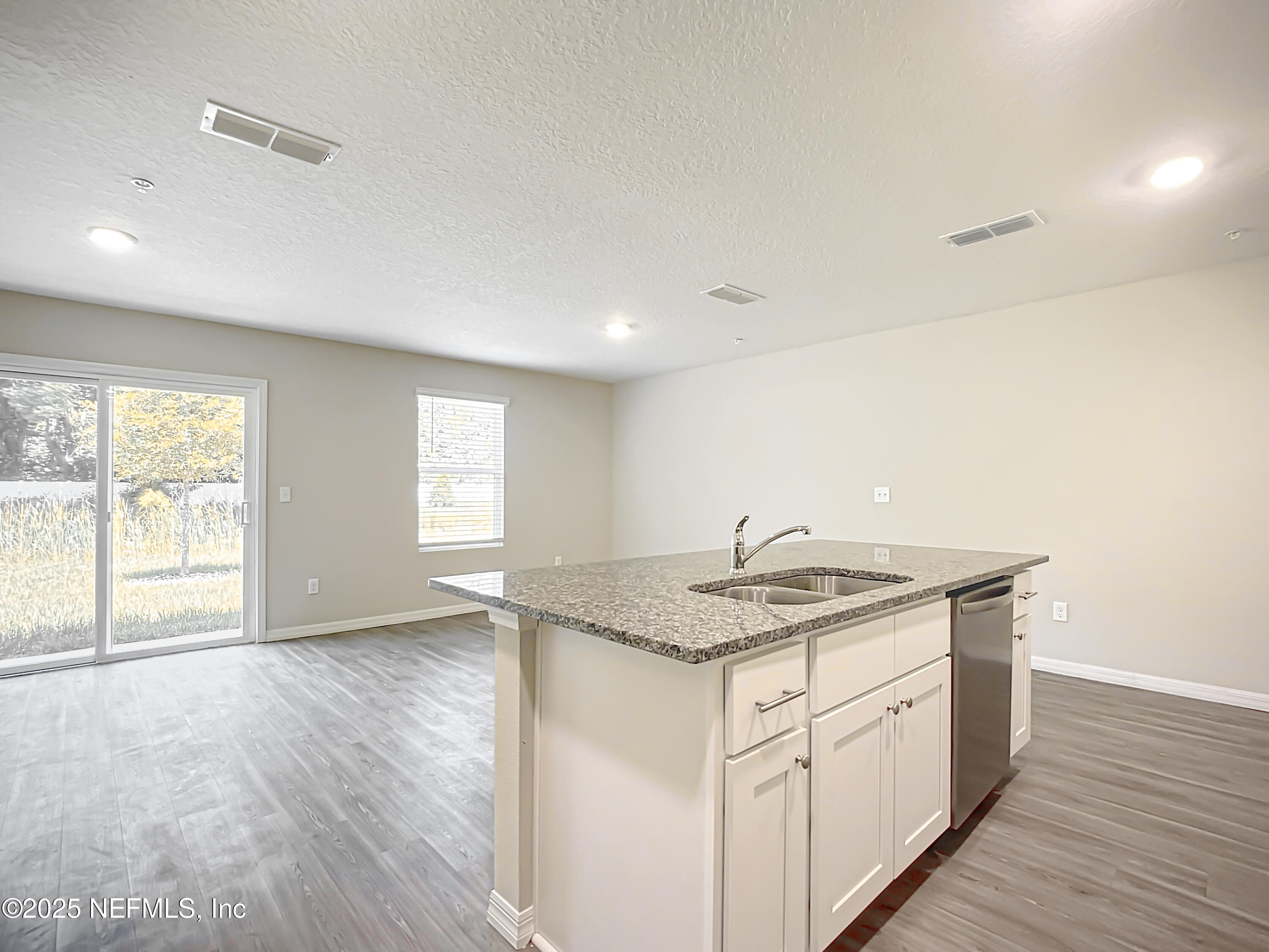 9612 Hood Road Jacksonville, FL 32257 - Photo 6 of 20 a bathroom with a granite countertop sink and a window