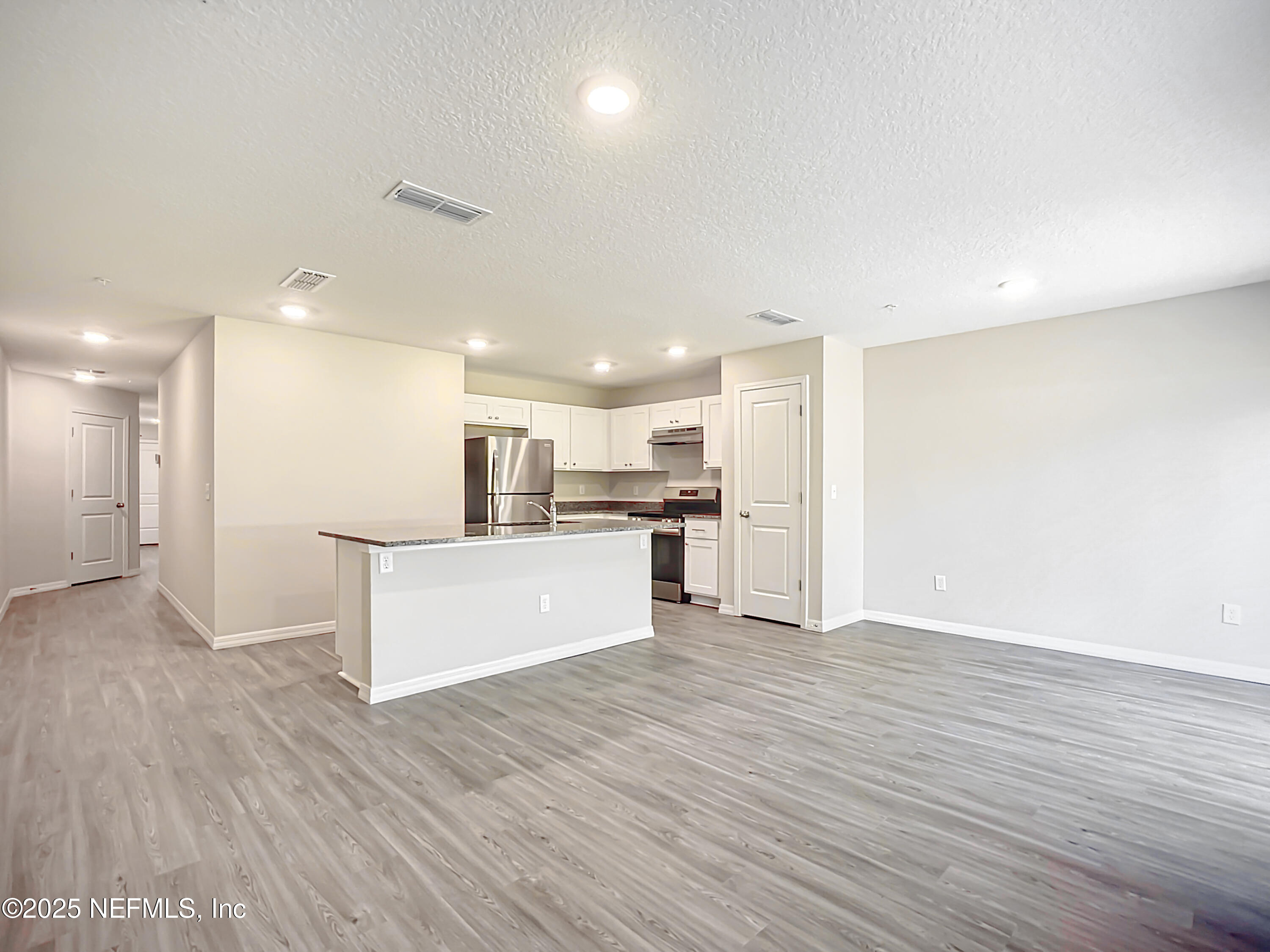 9612 Hood Road Jacksonville, FL 32257 - Photo 8 of 20 a view of kitchen with wooden floor