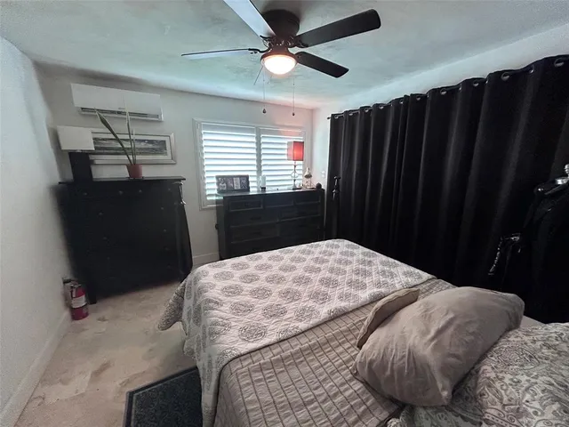 a bedroom with a bed and a walk in closet