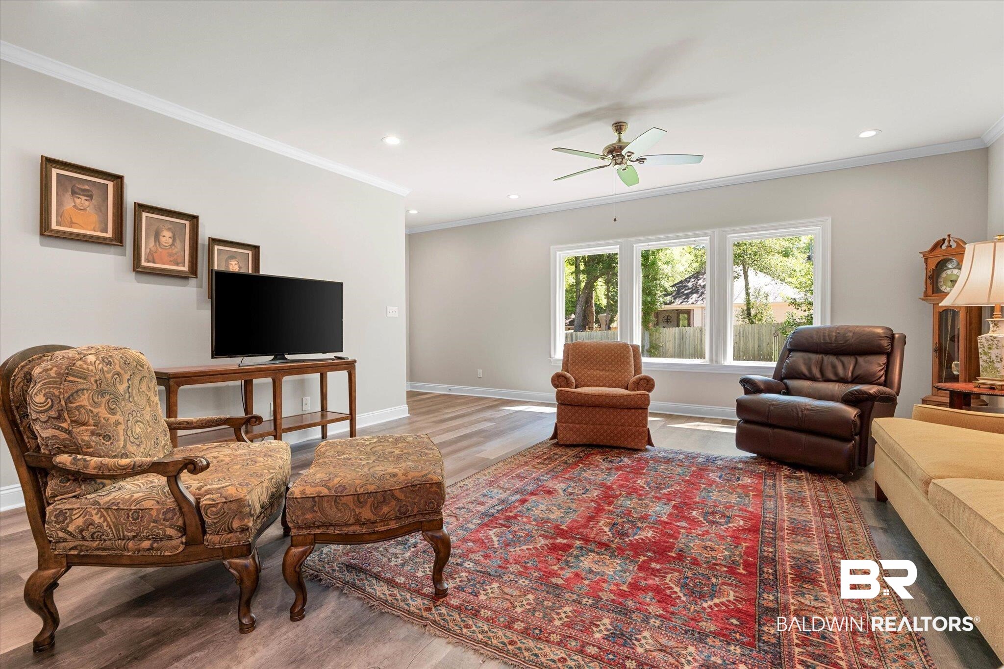 1101 Pinemont Drive Mobile, AL 36609 - Photo 5 of 18 Living area with wood finished floors, ceiling fan, baseboards, ornamental molding, and recessed lighting