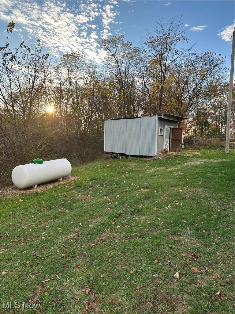 44952 Moose Ridge Road Woodsfield, OH 43793 - Photo 45 of 48 View of grassy yard with an outbuilding in back yard