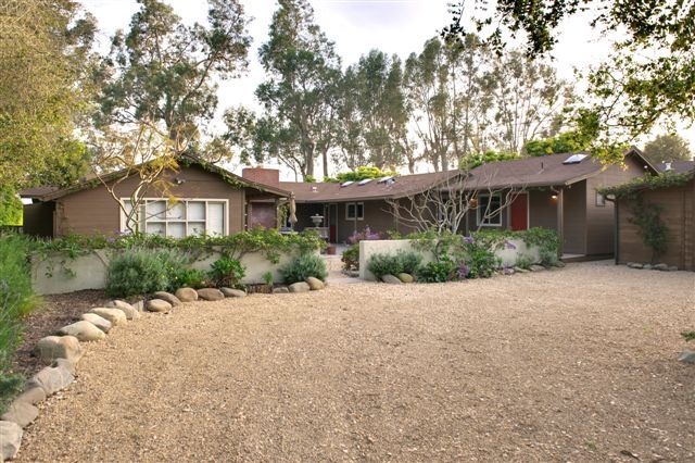 2417 Medcliff Road Santa Barbara, CA 93109 - Photo 1 of 21 a view of a house with a small yard and a large tree