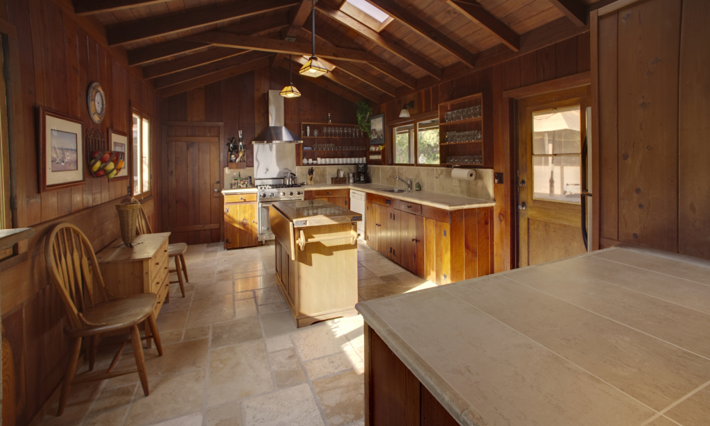 2417 Medcliff Road Santa Barbara, CA 93109 - Photo 11 of 21 a kitchen with sink a refrigerator and chairs