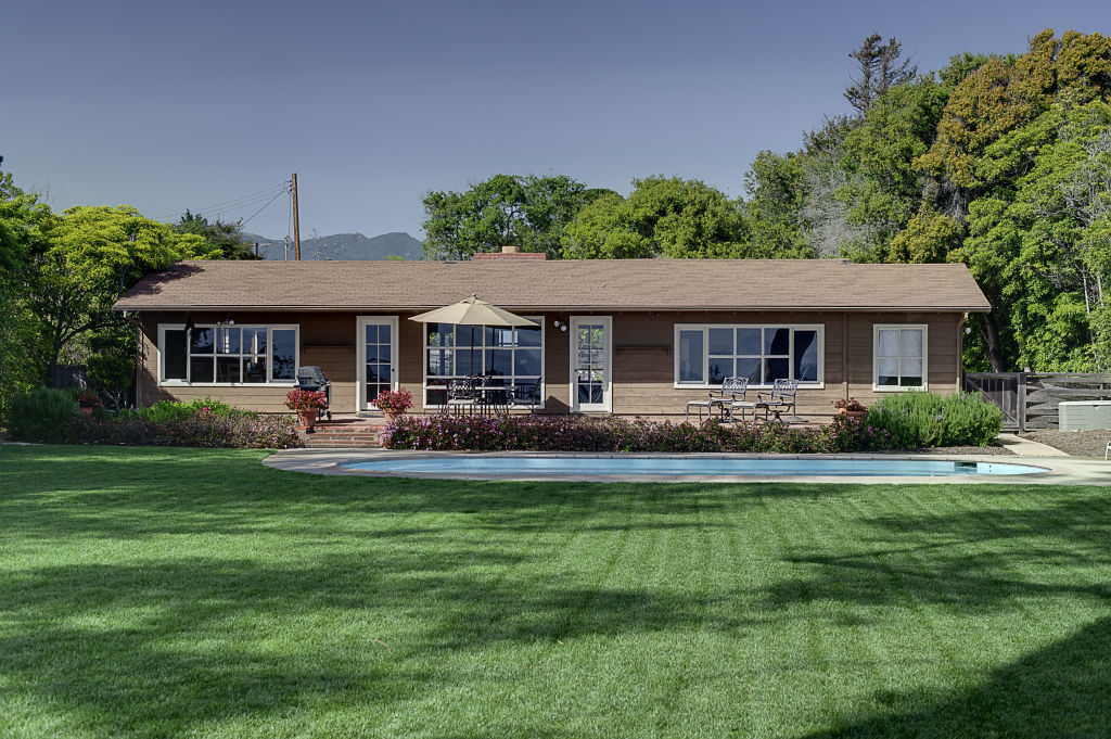 2417 Medcliff Road Santa Barbara, CA 93109 - Photo 13 of 21 a front view of a house with a yard table and chairs