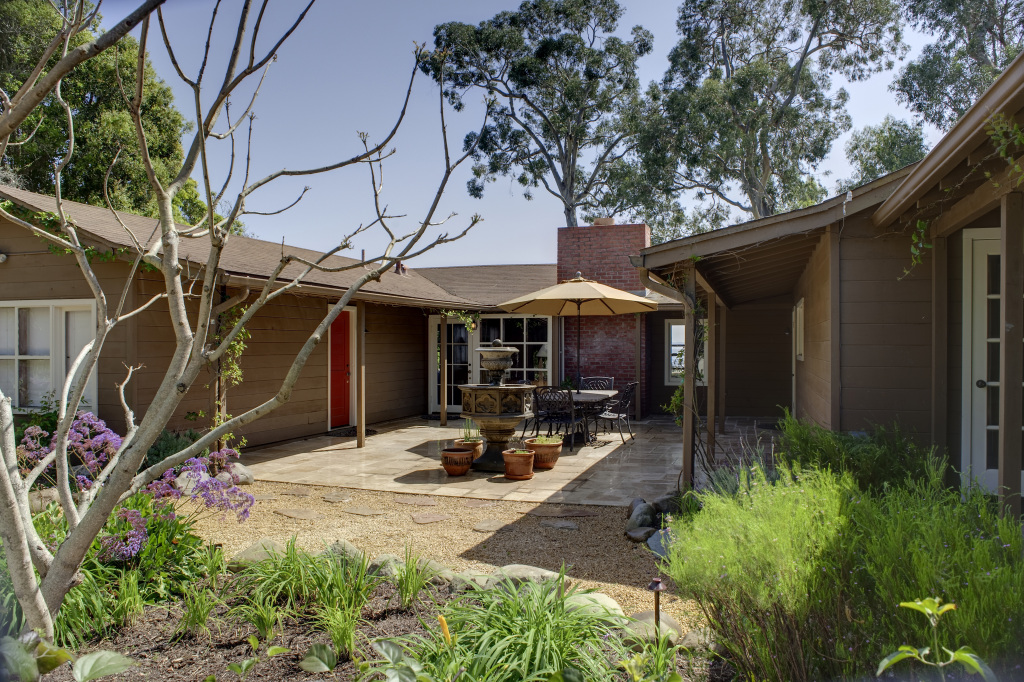 2417 Medcliff Road Santa Barbara, CA 93109 - Photo 16 of 21 a view of a patio with table and chairs under an umbrella