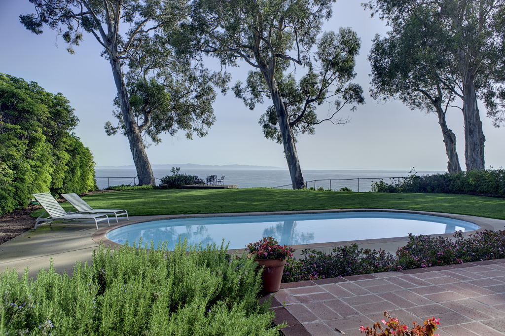 2417 Medcliff Road Santa Barbara, CA 93109 - Photo 19 of 21 a view of a lake with a yard and large trees
