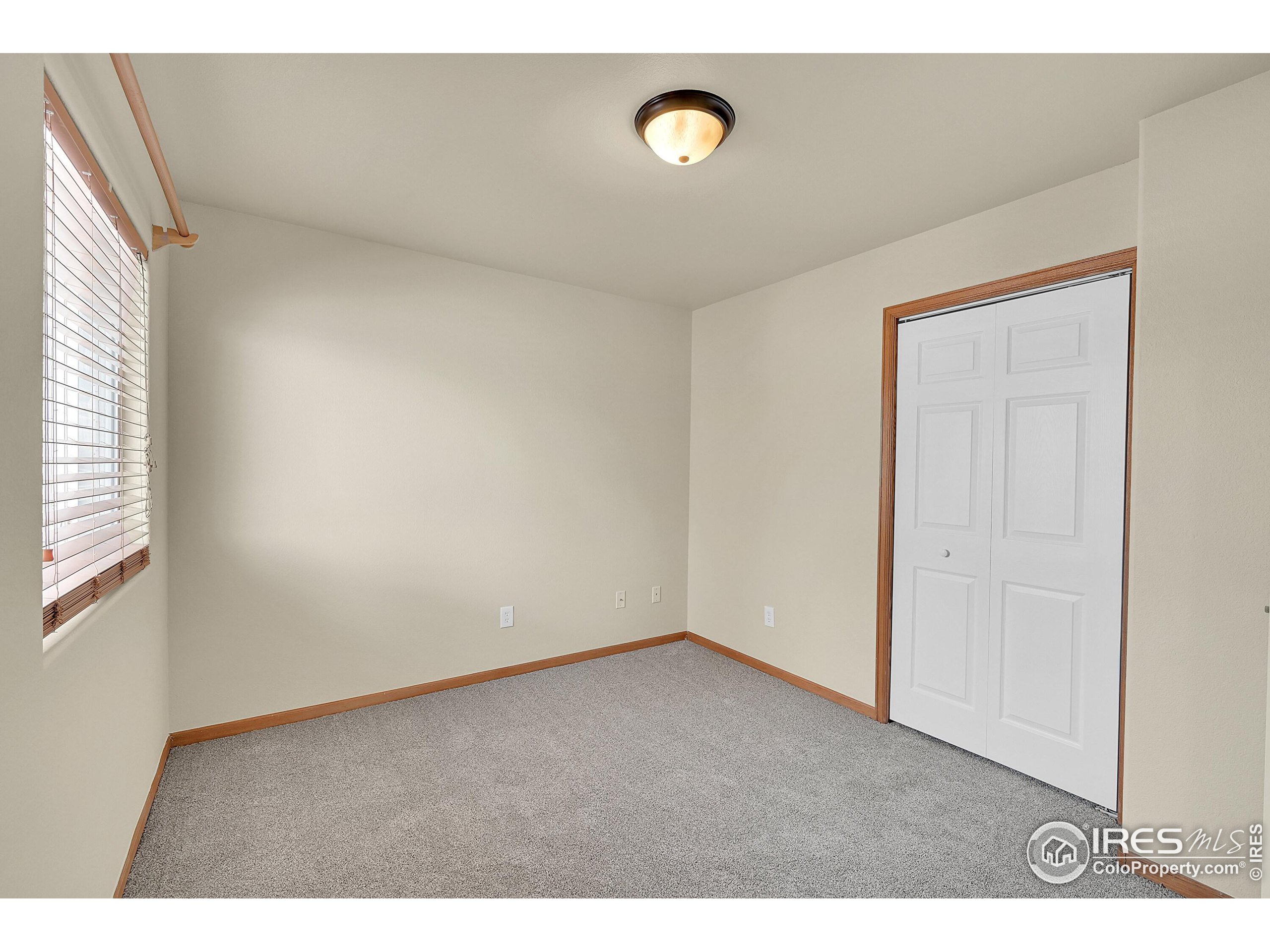 1325 Darrell Road Evans, CO 80620 - Photo 16 of 25 a view of an empty room with a window