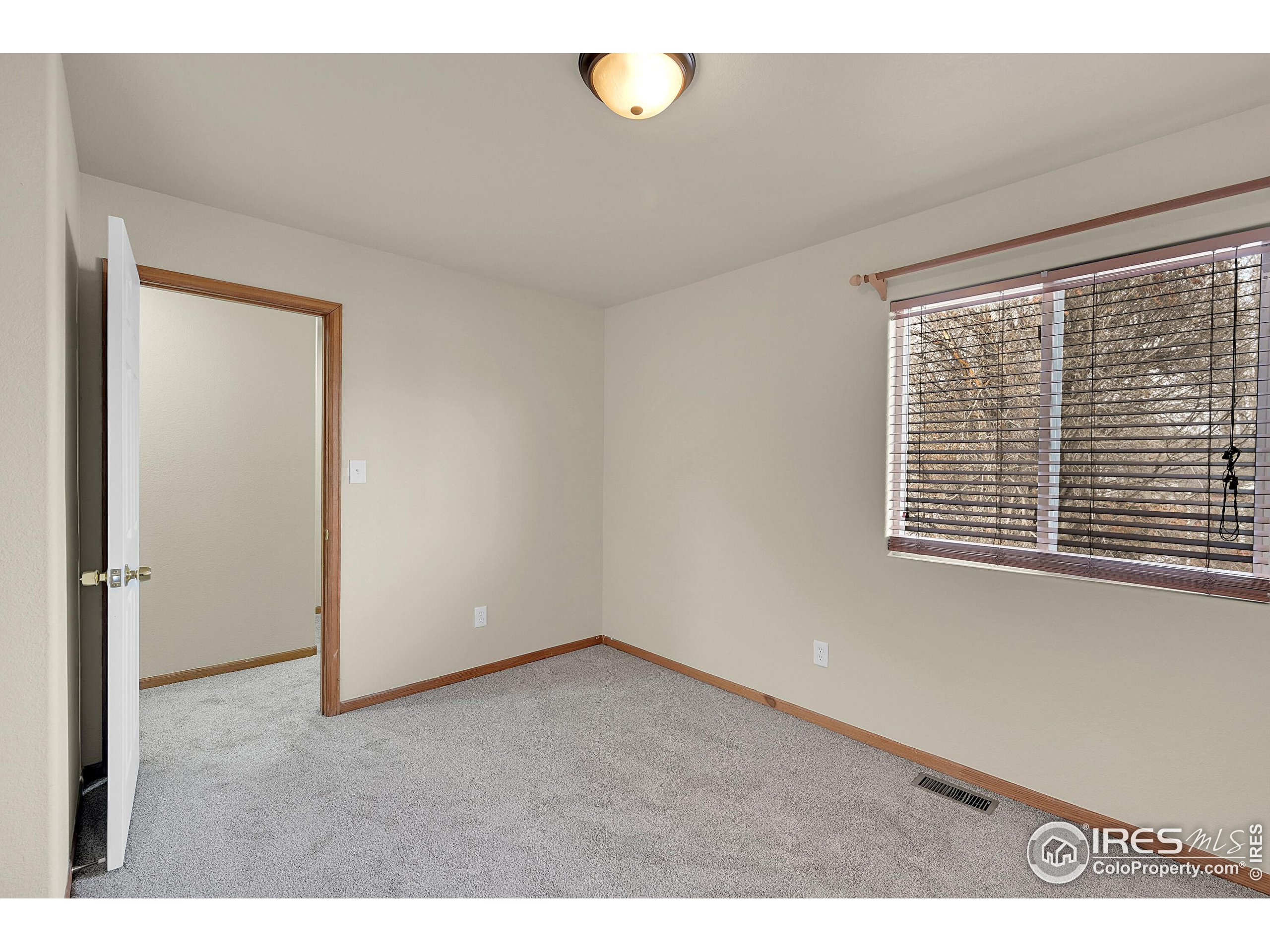 1325 Darrell Road Evans, CO 80620 - Photo 17 of 25 a view of an empty room with a window
