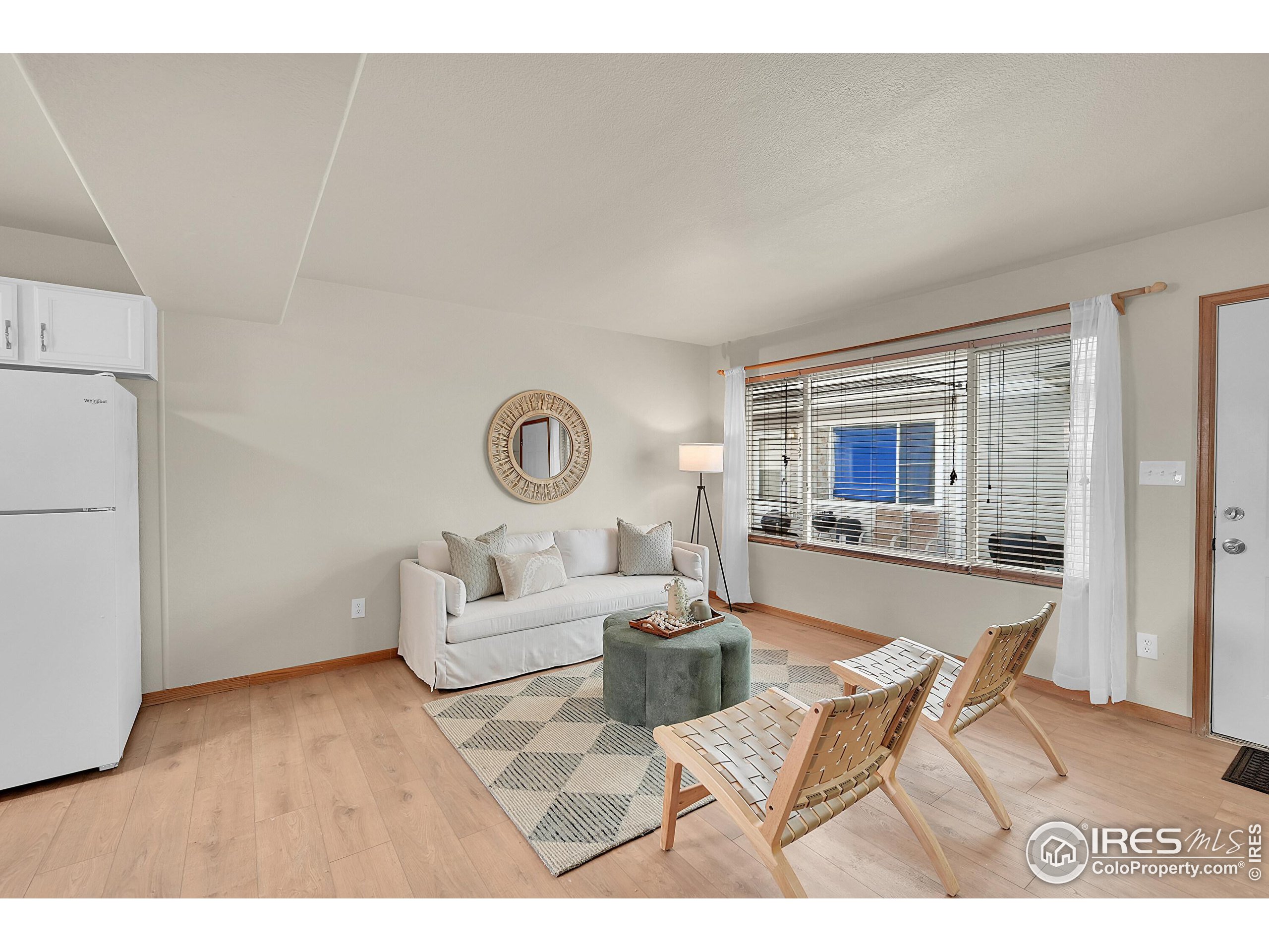 1325 Darrell Road Evans, CO 80620 - Photo 3 of 25 a living room with furniture and a window
