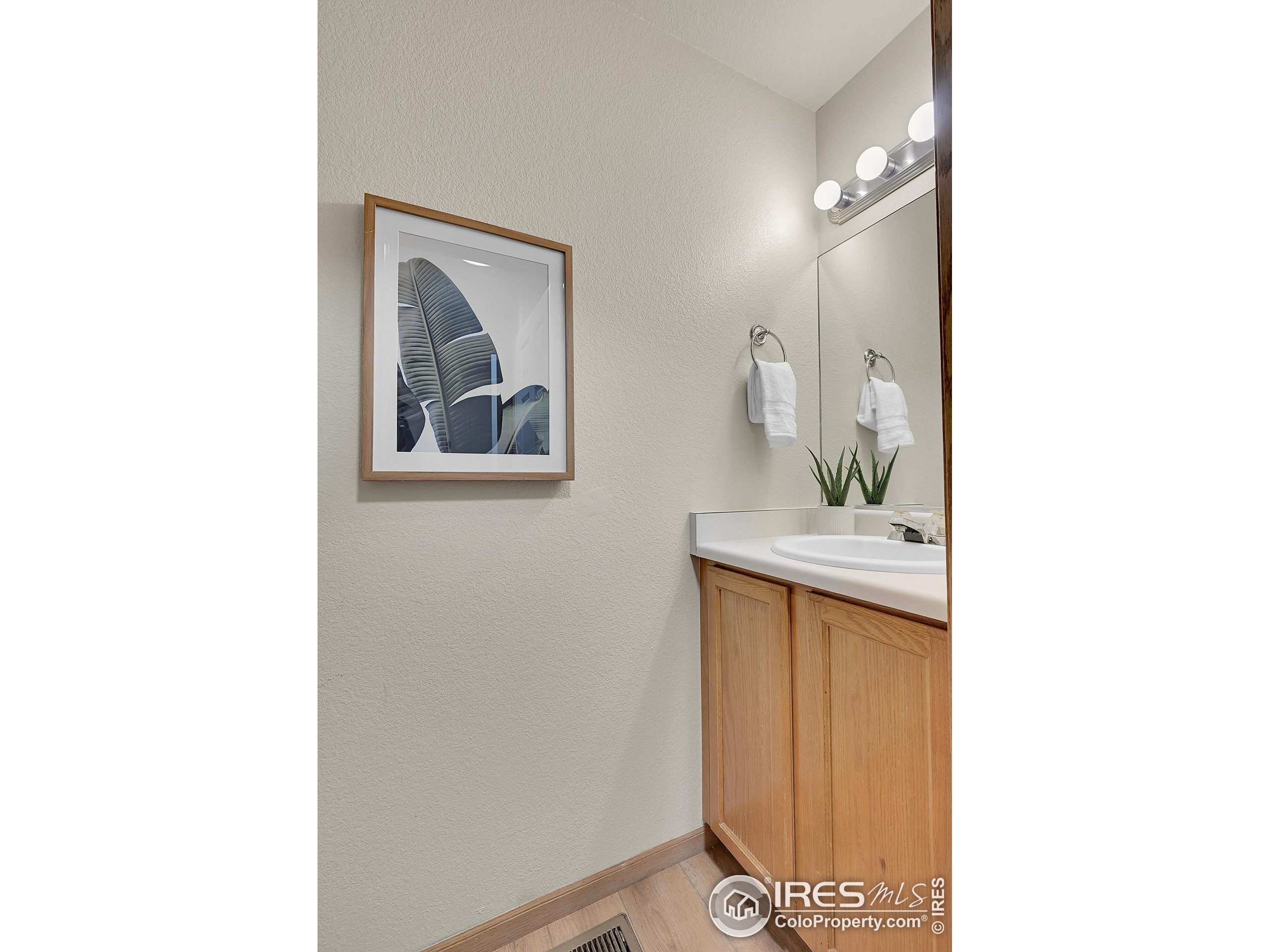 1325 Darrell Road Evans, CO 80620 - Photo 6 of 25 a bathroom with a sink and a mirror