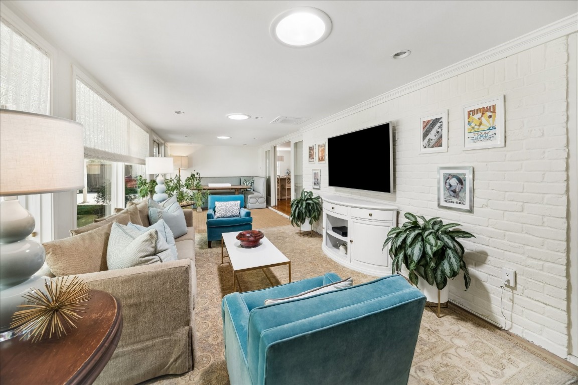 907 Wild Valley Road Houston, TX 77057 - Photo 14 of 31 This bright room is off the family room and has doors to close off the space.