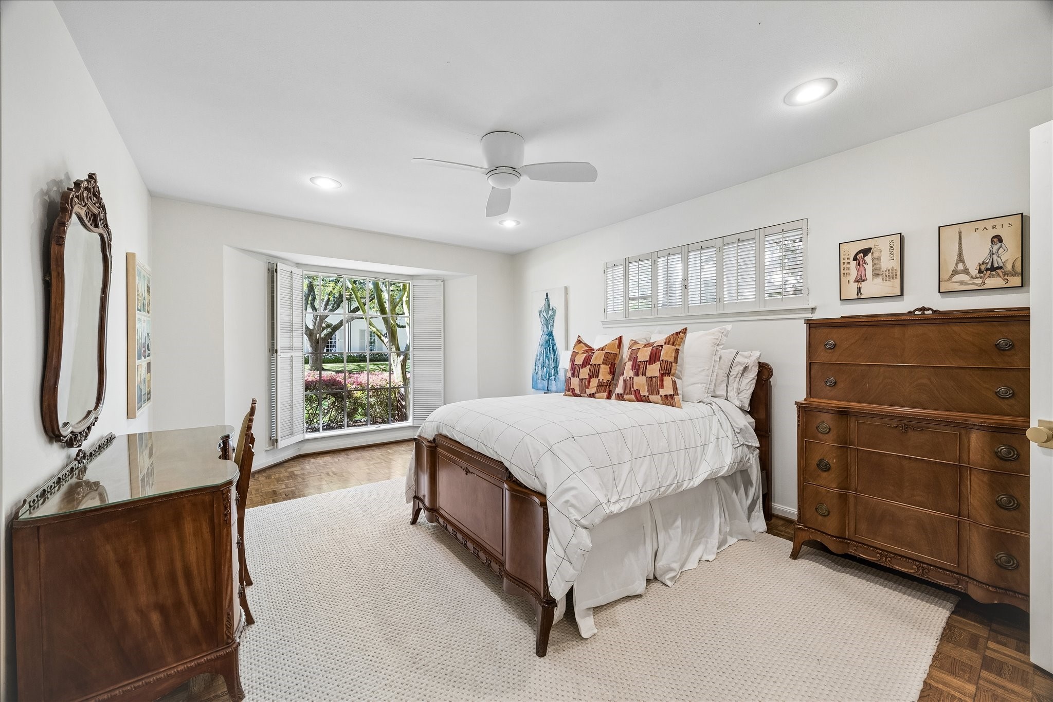 907 Wild Valley Road Houston, TX 77057 - Photo 19 of 31 a bed room with a bed and a dresser