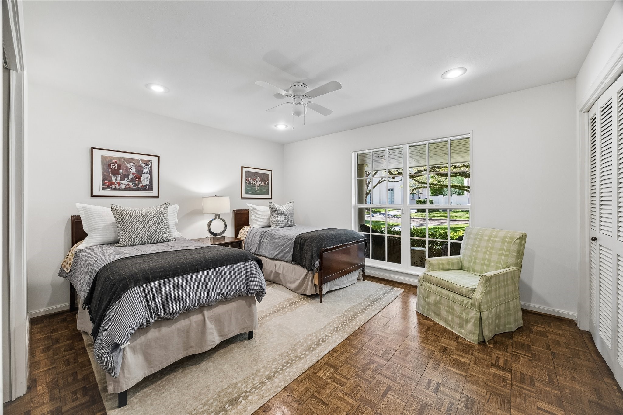 907 Wild Valley Road Houston, TX 77057 - Photo 21 of 31 a spacious bedroom with a bed a couch and a window