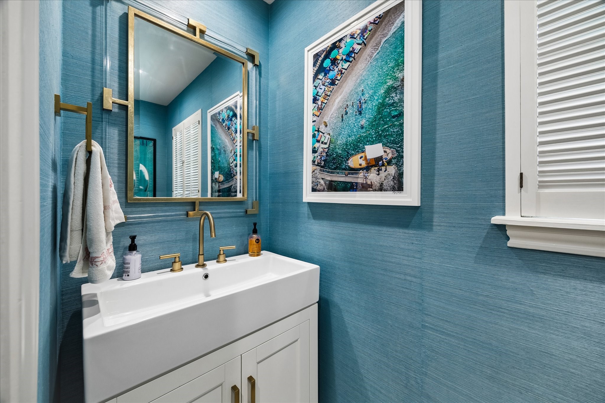 907 Wild Valley Road Houston, TX 77057 - Photo 25 of 31 a bathroom with a sink and a mirror