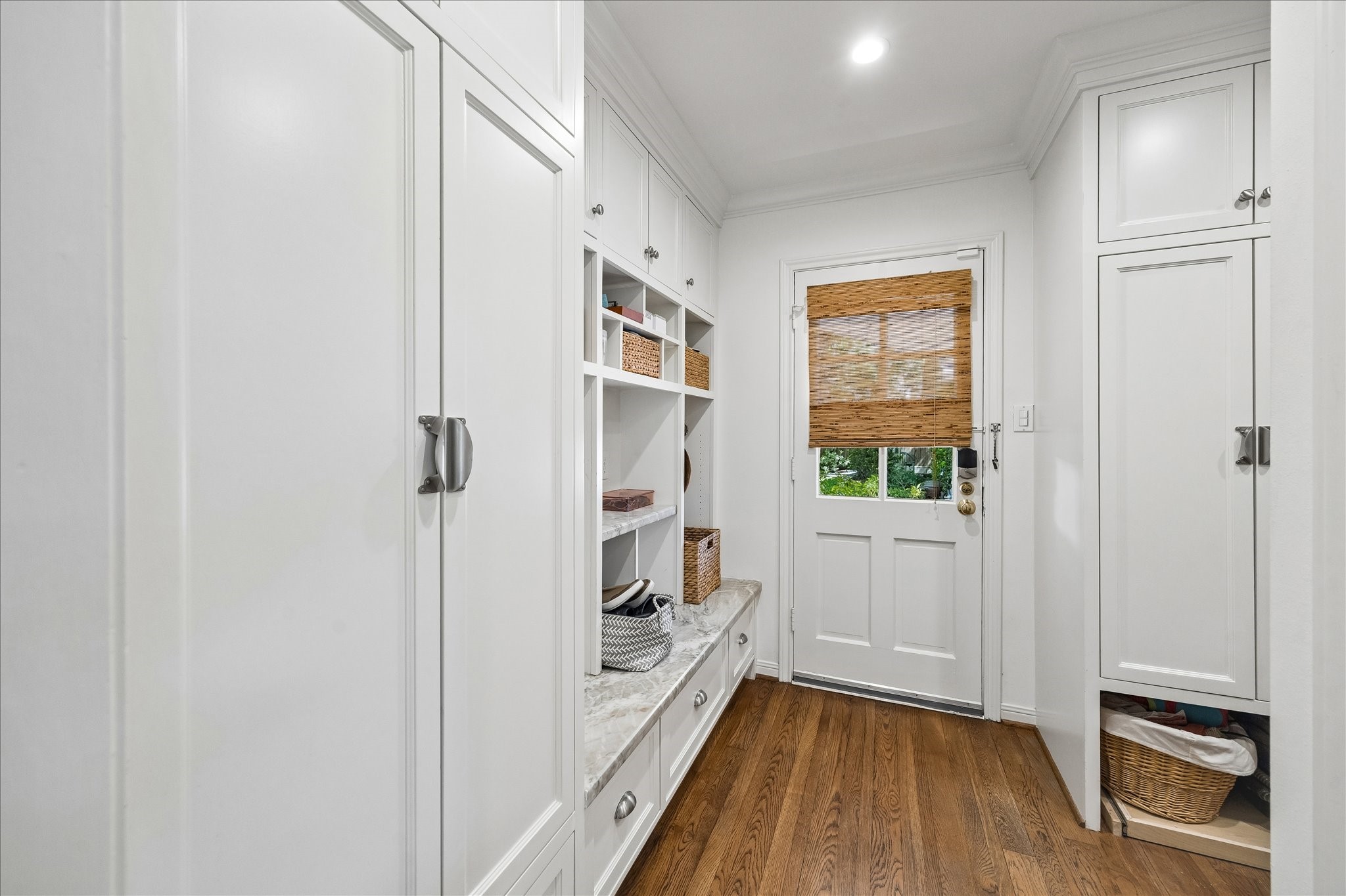 907 Wild Valley Road Houston, TX 77057 - Photo 26 of 31 a view of hallway with a large window and wooden floor