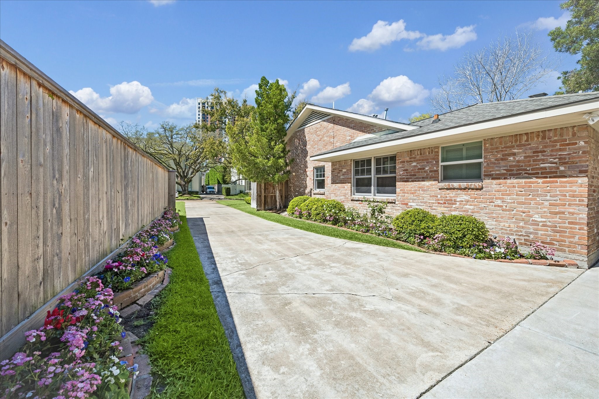 907 Wild Valley Road Houston, TX 77057 - Photo 31 of 31 a view of a house with backyard and garden