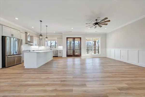 an aerial view of a house with a yard table and chairs