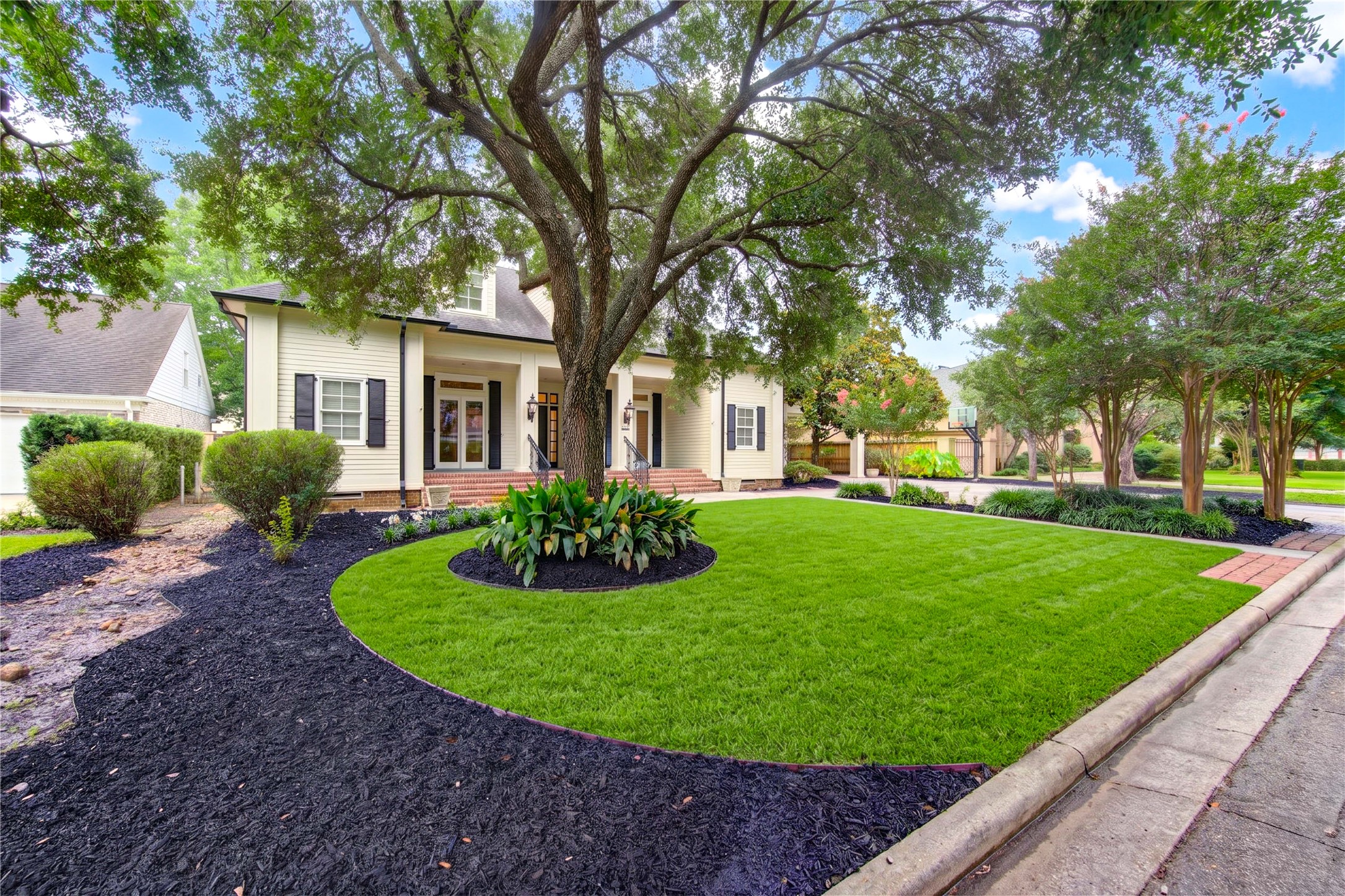 4615 Laurel Street Bellaire, TX 77401 - Photo 2 of 48 Stunning trees and foliage makes this special home so inviting! Owner added 6" gutters around house.
