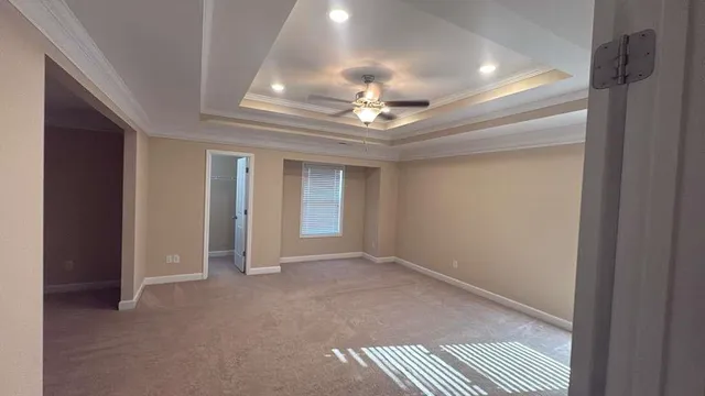 a view of an empty room with a chandelier