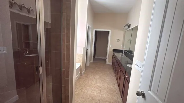 a view of a hallway with closet and a door