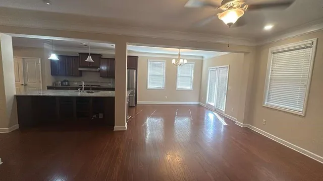 a view of a kitchen cabinets and wooden floor