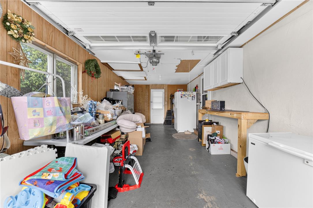 7290 Heather Road Macungie, PA 18062 - Photo 21 of 39 A versatile garage space offers ample storage, cabinetry, and work surfaces.