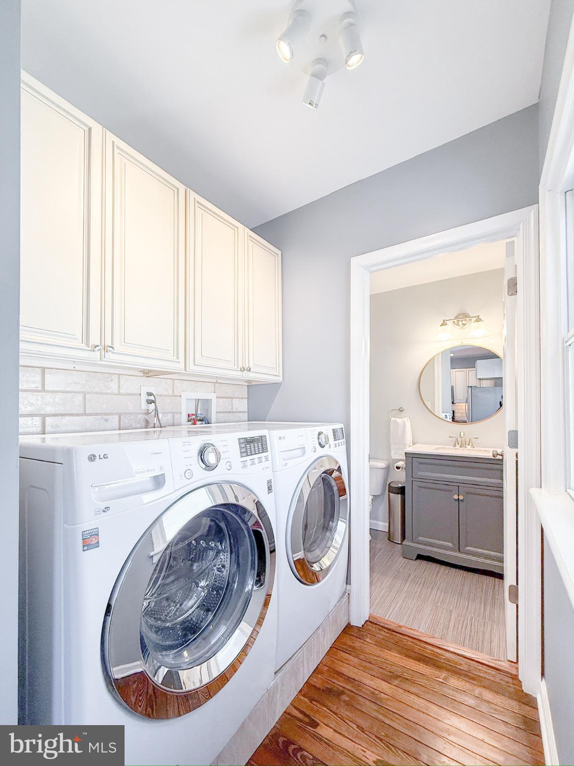 209 West Madison Avenue Magnolia, NJ 08049 - Photo 5 of 11 a utility room with sink dryer and washer