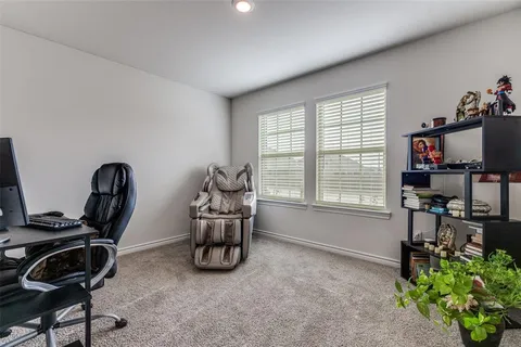 a room with furniture and musical instruments
